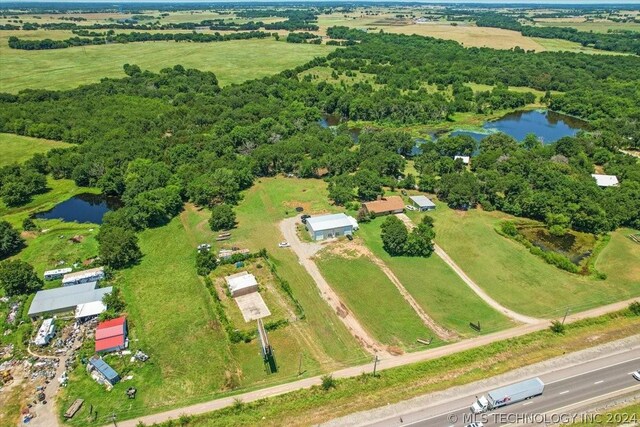 bird's eye view with a rural view and a water view