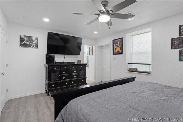 bedroom with ceiling fan, recessed lighting, light wood-style flooring, and baseboards