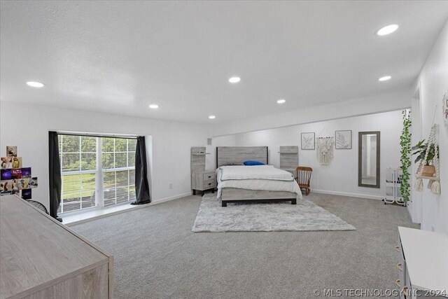 bedroom featuring light carpet, baseboards, and recessed lighting