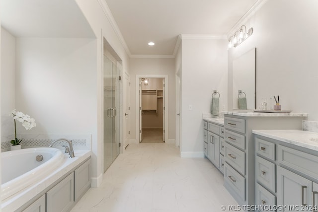 bathroom with ornamental molding, vanity, and independent shower and bath