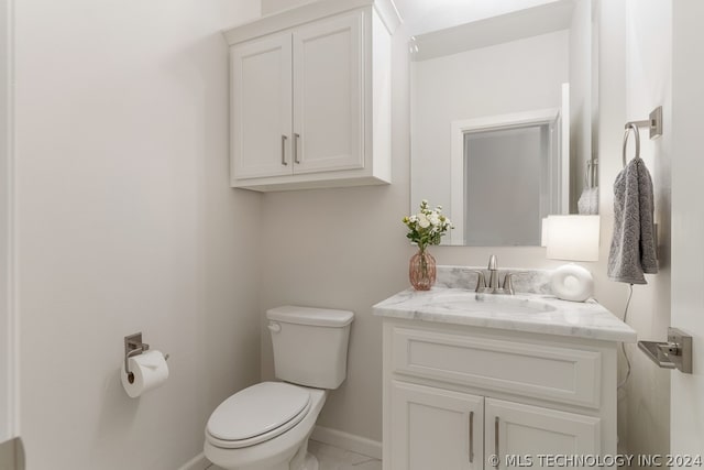 bathroom with toilet and vanity