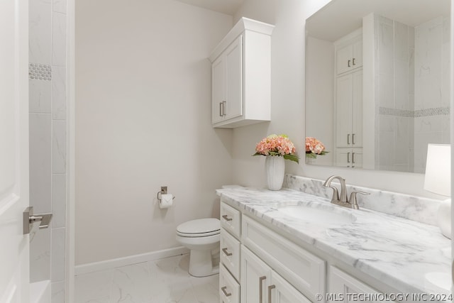 bathroom with walk in shower, toilet, and vanity