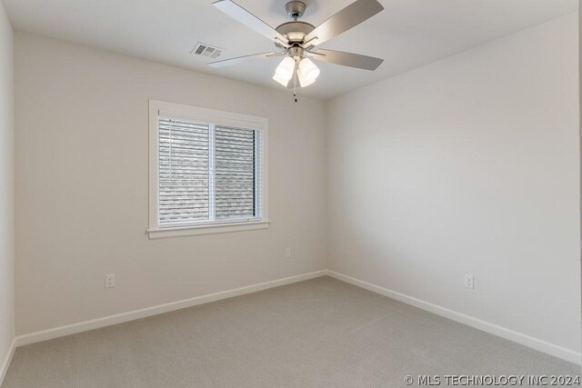 carpeted empty room with ceiling fan