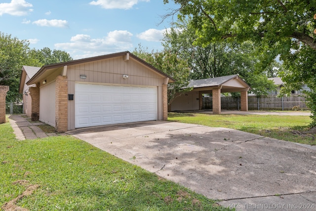 exterior space featuring a carport and a yard