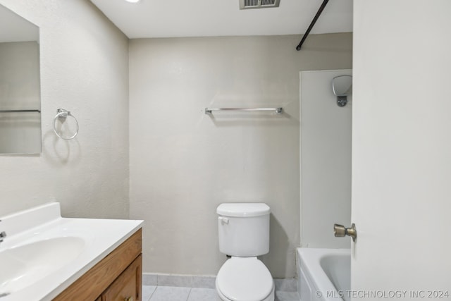 bathroom featuring tile patterned floors, toilet, and vanity