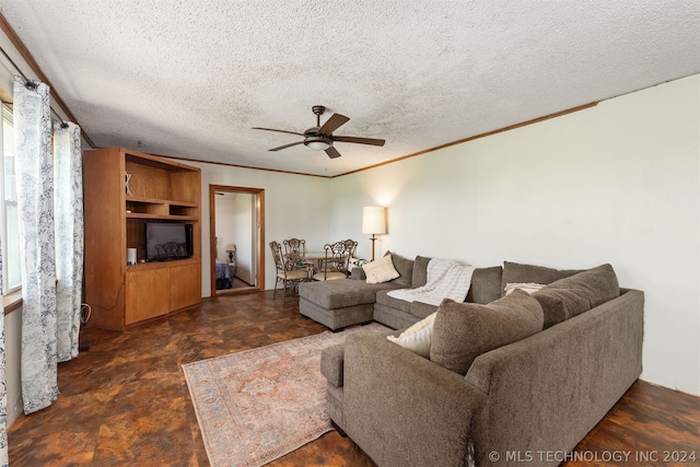 living room featuring ceiling fan and a textured ceiling