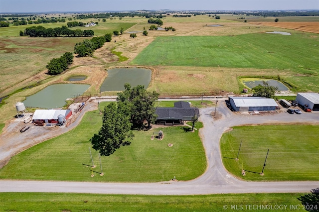 aerial view with a water view and a rural view