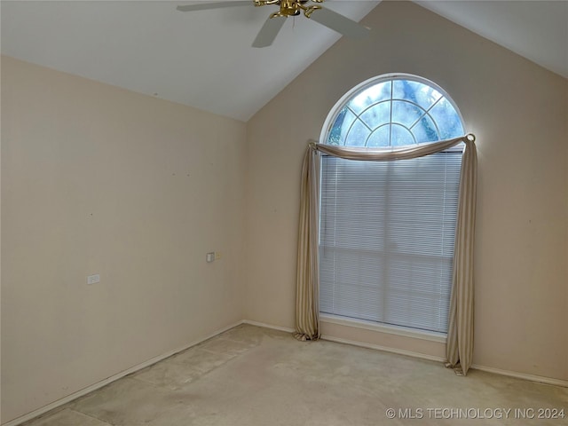 carpeted empty room featuring lofted ceiling and ceiling fan