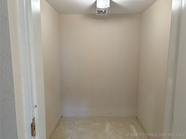 spare room with a textured ceiling