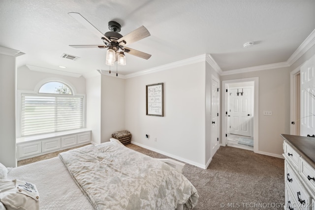 carpeted bedroom featuring ceiling fan and ornamental molding