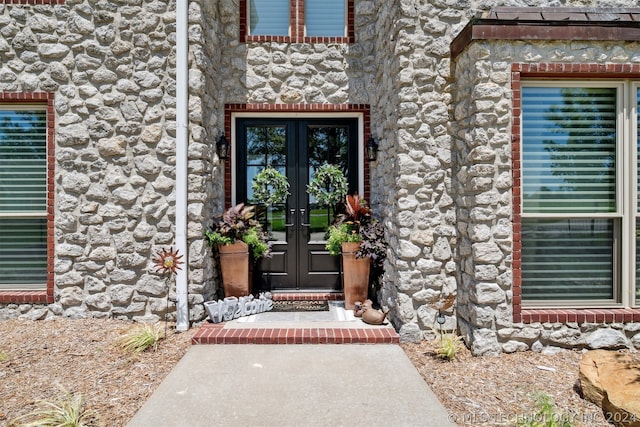 view of exterior entry featuring french doors