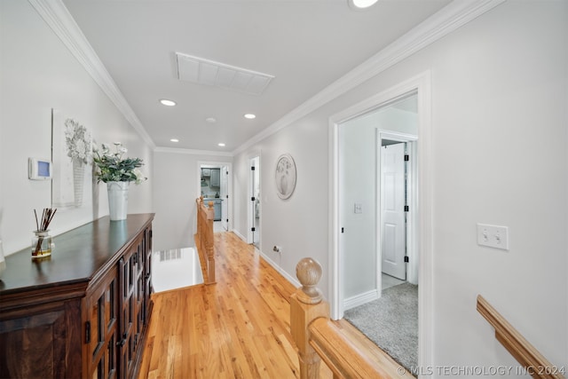 hall featuring hardwood / wood-style floors and ornamental molding