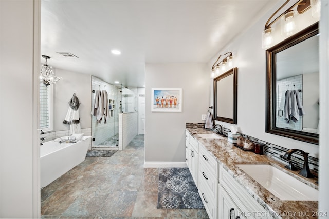 bathroom with vanity and separate shower and tub