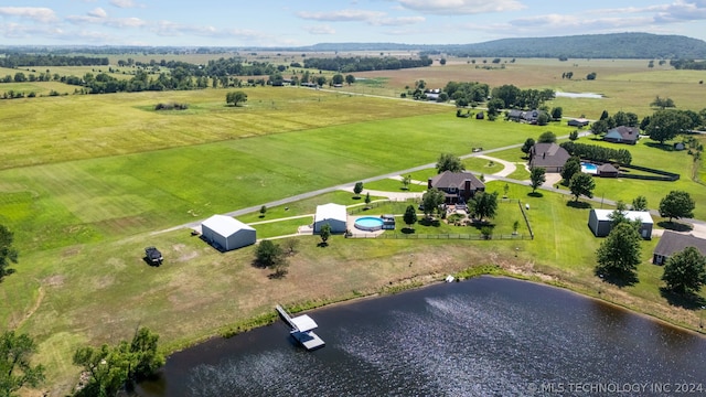 bird's eye view with a water and mountain view and a rural view