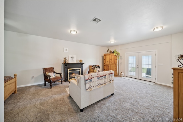 living room with carpet floors and french doors