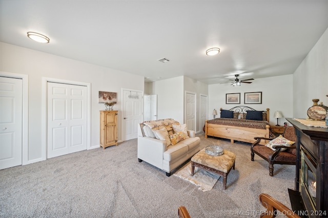 living room with ceiling fan and light carpet