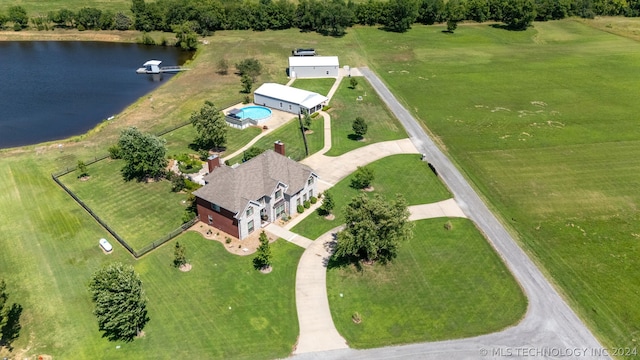 birds eye view of property featuring a water view and a rural view