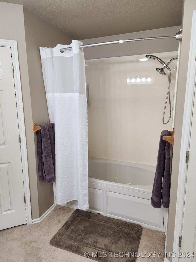 bathroom featuring a textured ceiling and shower / tub combo with curtain