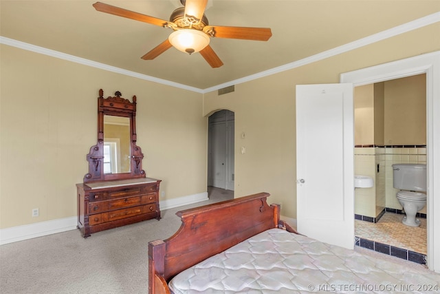 bedroom with ensuite bathroom, ceiling fan, crown molding, and light carpet