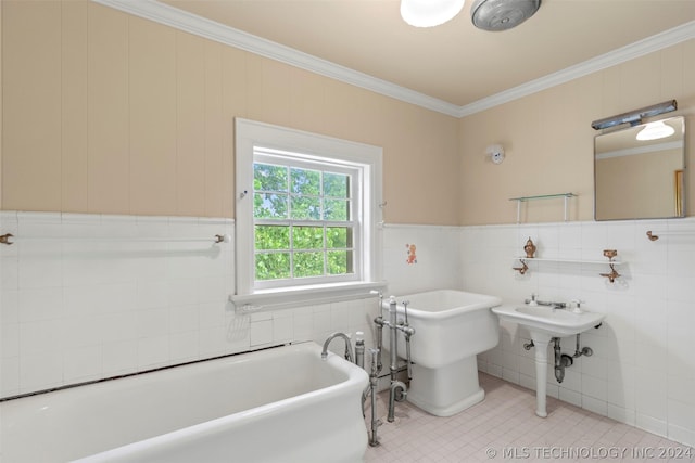 bathroom with tile patterned floors, tile walls, a bathing tub, and crown molding