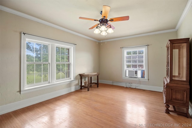 spare room with ceiling fan, cooling unit, crown molding, and light hardwood / wood-style flooring