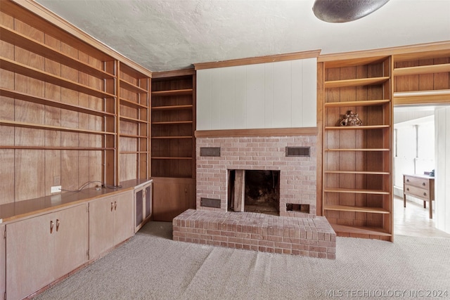 living room featuring wood walls, light colored carpet, and a fireplace