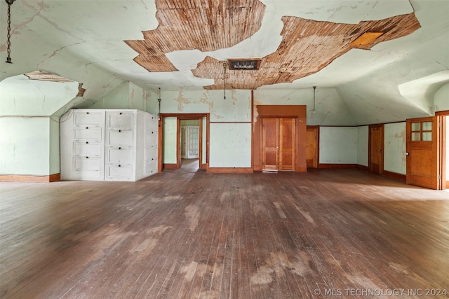 bonus room with hardwood / wood-style flooring and lofted ceiling