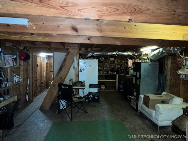 basement featuring white refrigerator