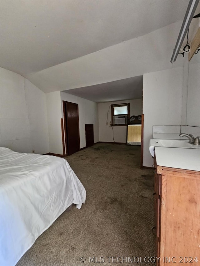 303 S B, Davis, OK 73030 - bedroom featuring a sink, dark carpet, cooling unit, and lofted ceiling