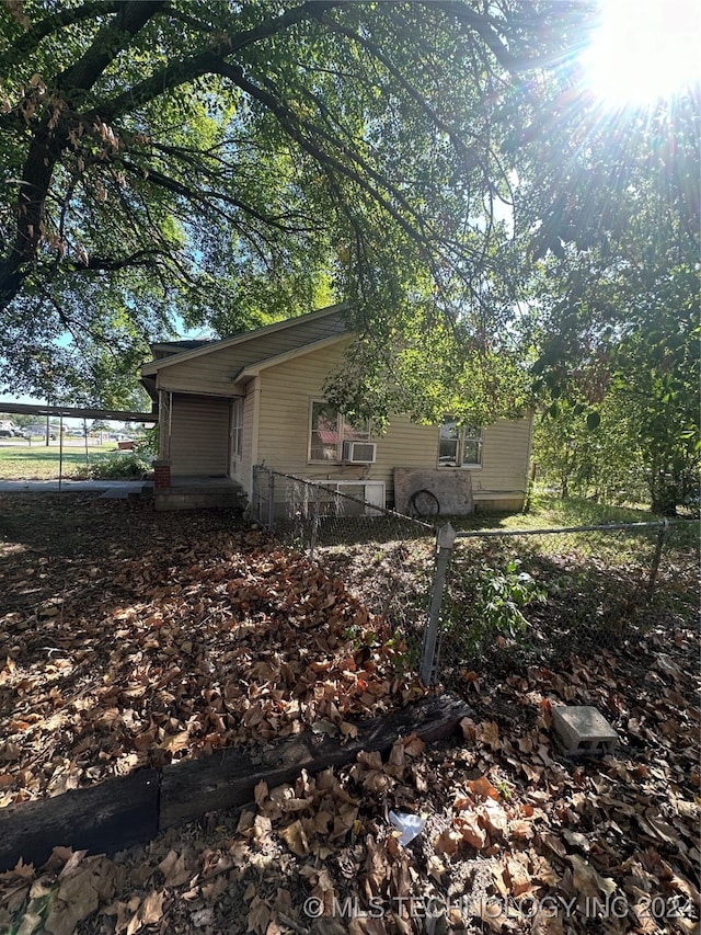 303 S B, Davis, OK 73030 - view of side of home featuring fence