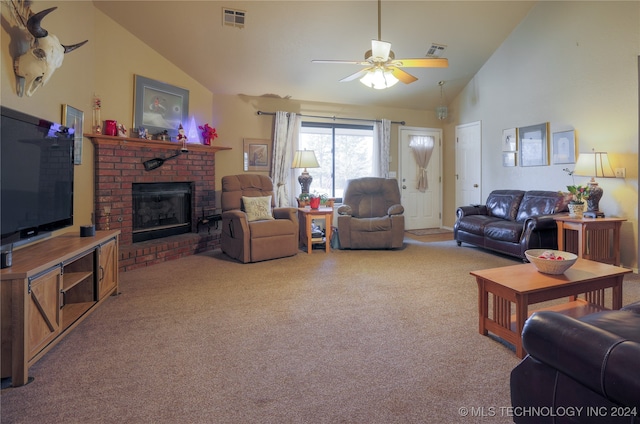 living room featuring high vaulted ceiling, light colored carpet, a brick fireplace, and ceiling fan