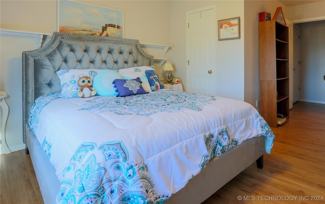 bedroom featuring wood-type flooring