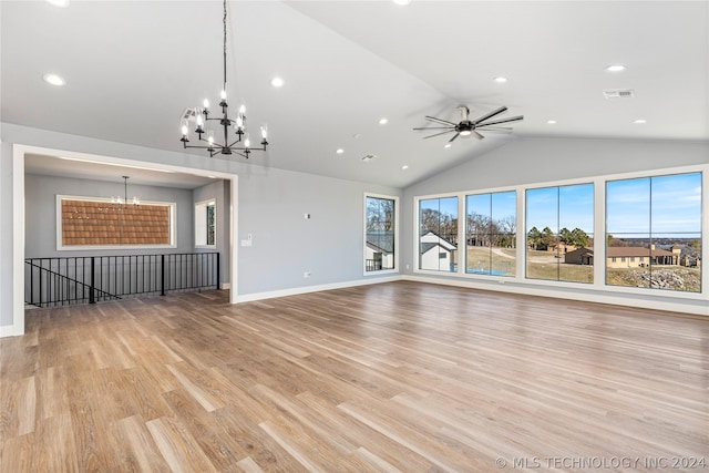 unfurnished living room with lofted ceiling, ceiling fan with notable chandelier, and light hardwood / wood-style flooring