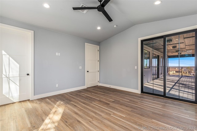 spare room with wood finished floors, a ceiling fan, lofted ceiling, and recessed lighting