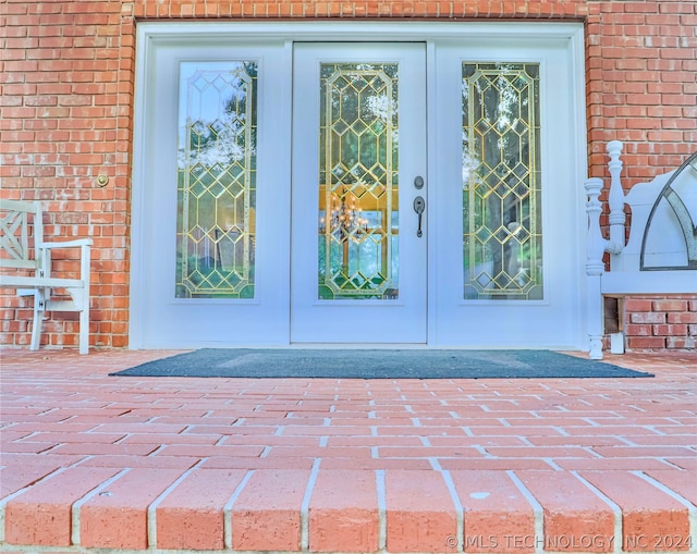 property entrance featuring french doors