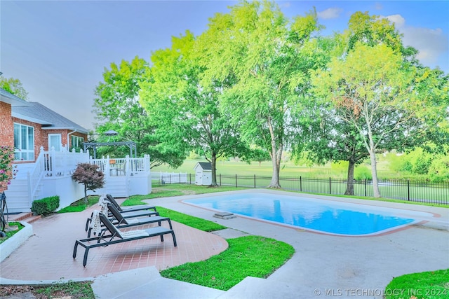 view of pool featuring a gazebo and a patio area