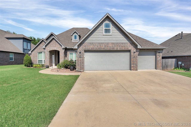 view of front of house featuring a garage and a front yard