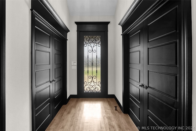 doorway to outside featuring hardwood / wood-style flooring