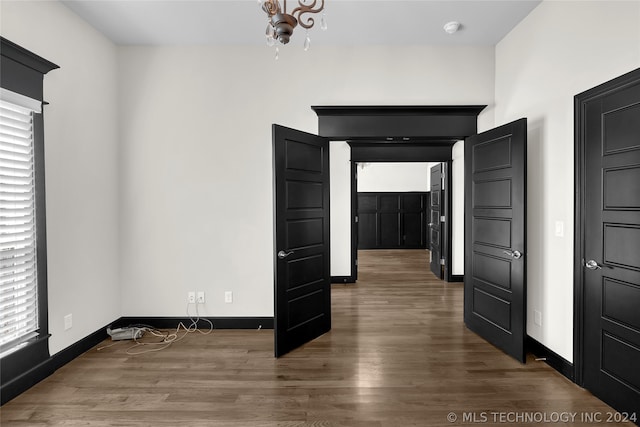 unfurnished room featuring dark hardwood / wood-style floors