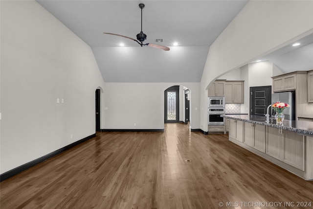 kitchen with ceiling fan, tasteful backsplash, dark hardwood / wood-style floors, and stainless steel appliances