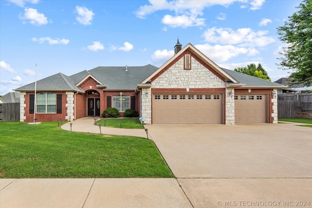 view of front facade featuring a garage and a front yard