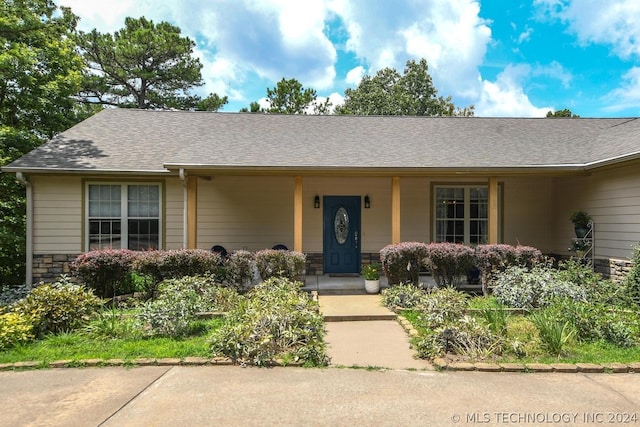 ranch-style house with covered porch