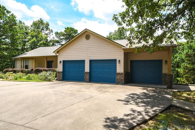 ranch-style home featuring a garage