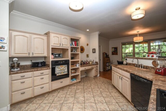 kitchen with pendant lighting, ornamental molding, sink, and black appliances