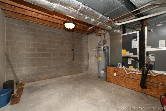 basement with strapped water heater