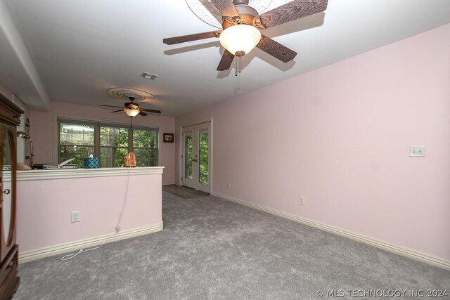 unfurnished room featuring light colored carpet