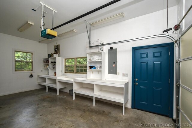 garage featuring a garage door opener and electric panel