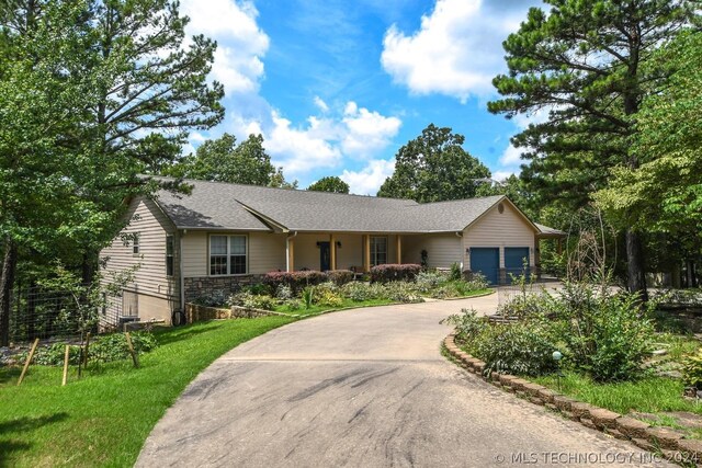 ranch-style house featuring a garage