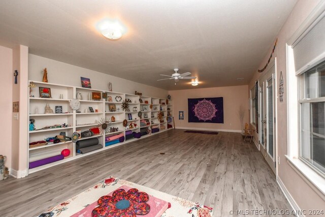 playroom featuring hardwood / wood-style flooring and ceiling fan