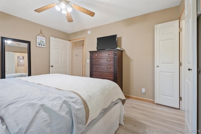 bedroom with light wood-type flooring and ceiling fan